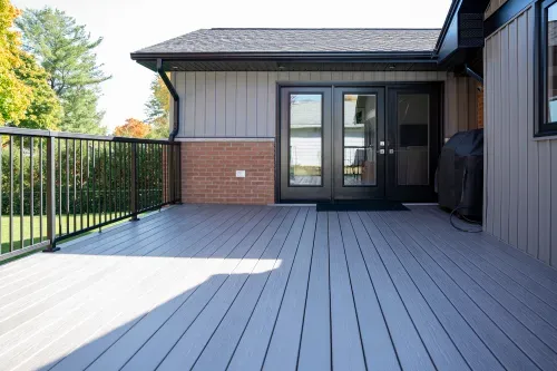 Home exterior with back deck and patio doors