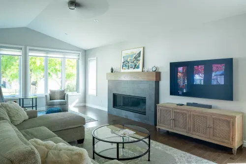 Living room addition with large glass doors leading to outside patio