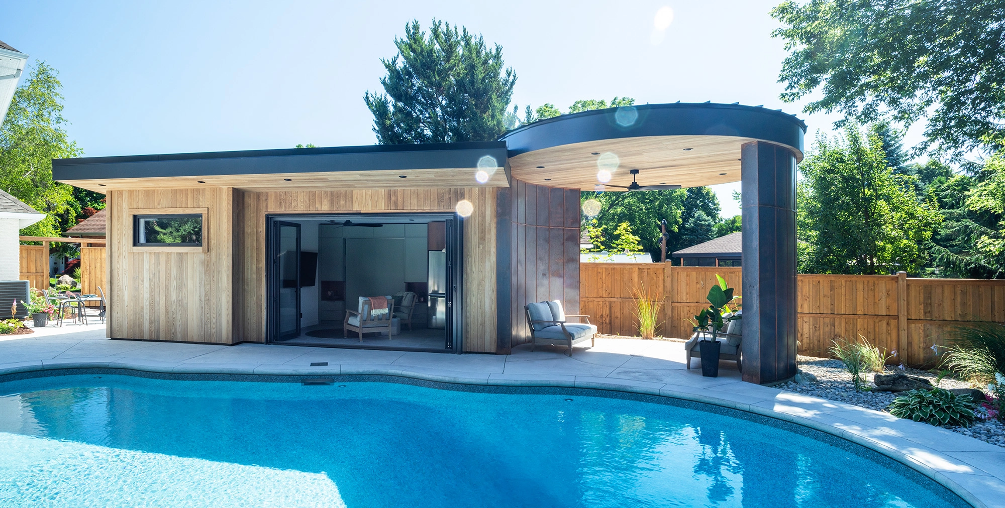 Modern and minimalist poolhouse with ash clads and open-air rotunda