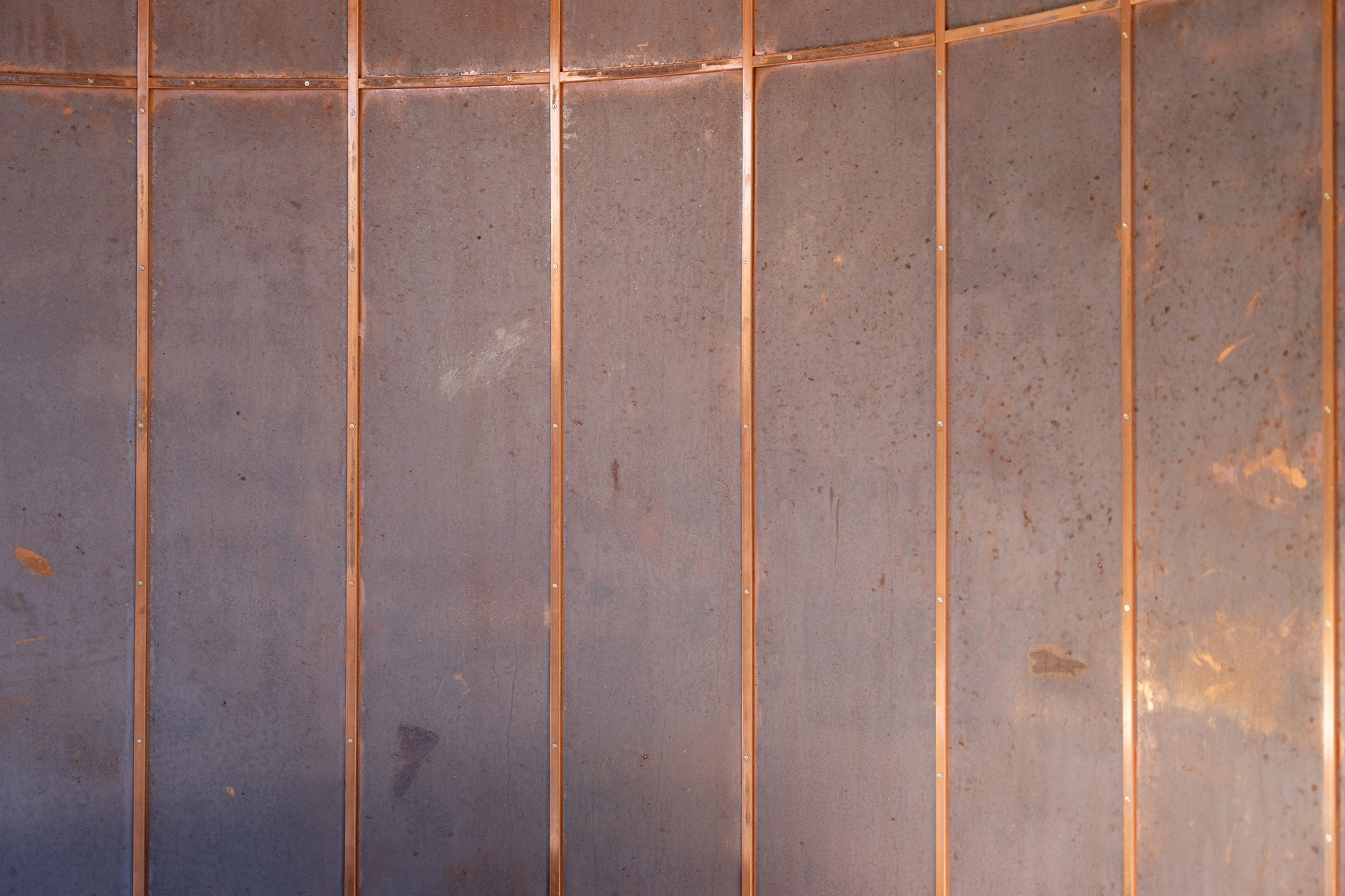 Detail shot of copper panelling on open air rotunda wall