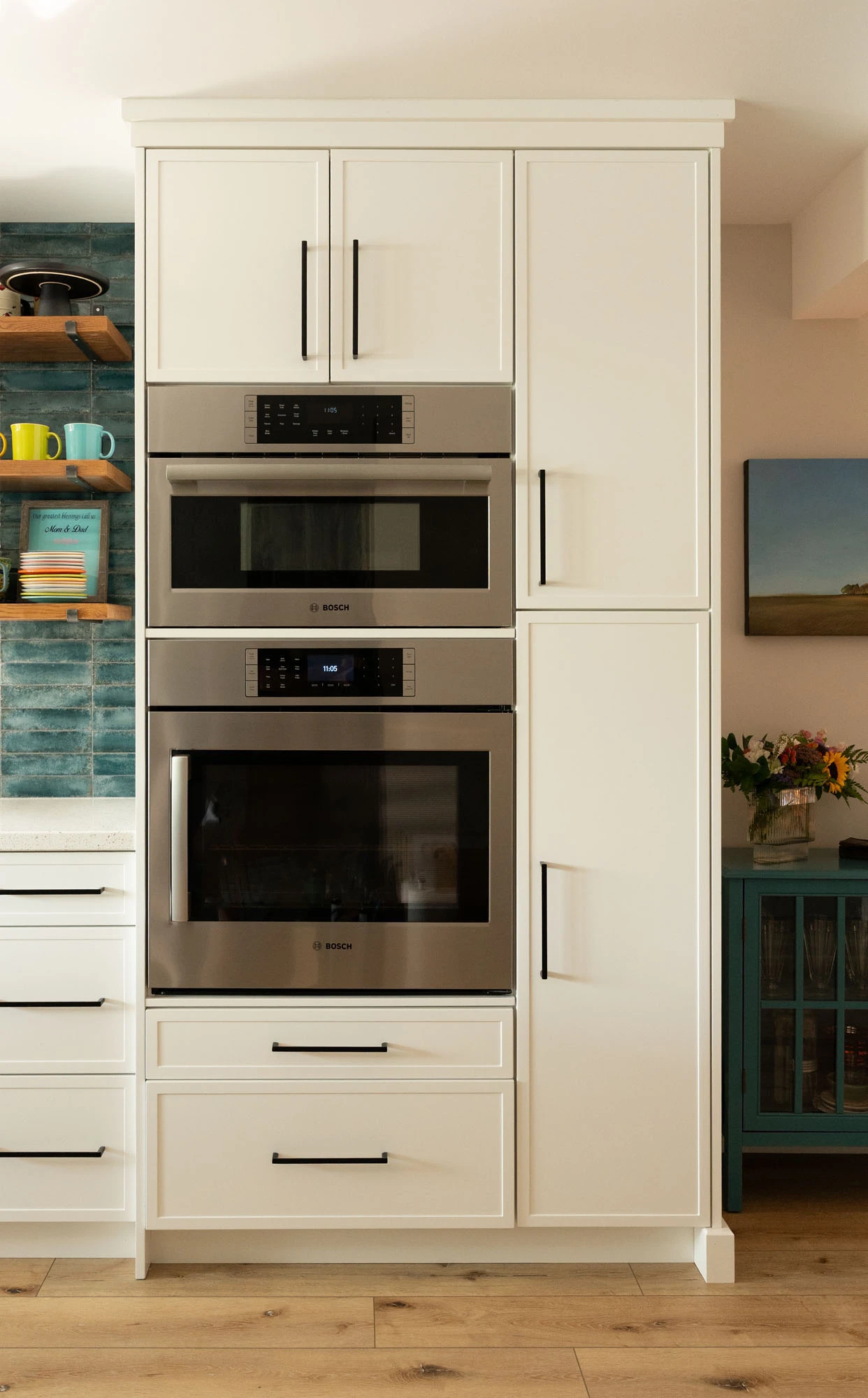 Double stainless steel ovens built into kitchen wall cabinetry