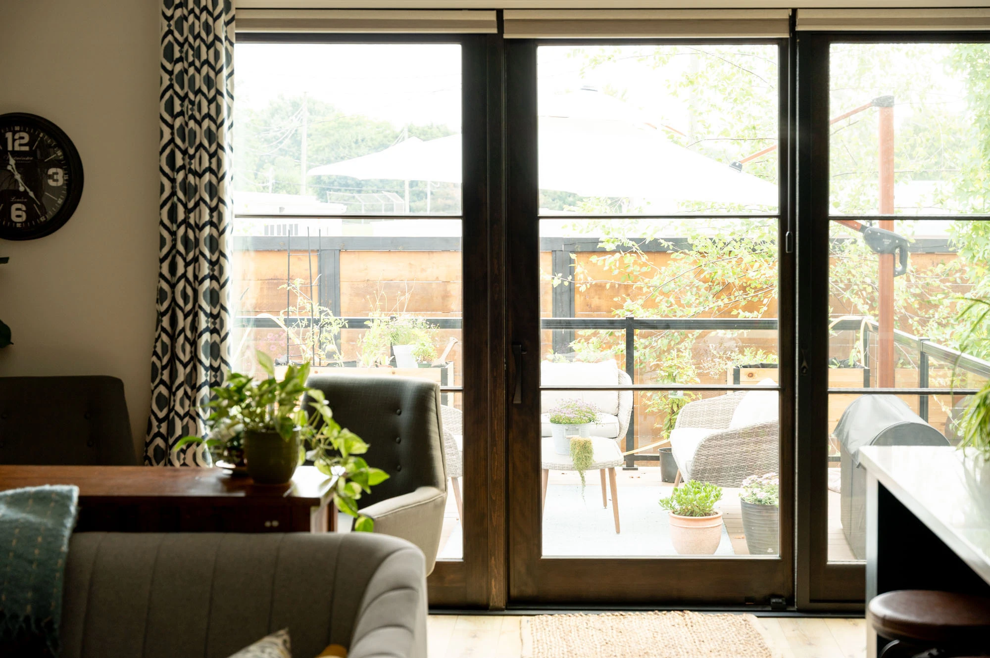 Large glass doors leading from living room out to patio area