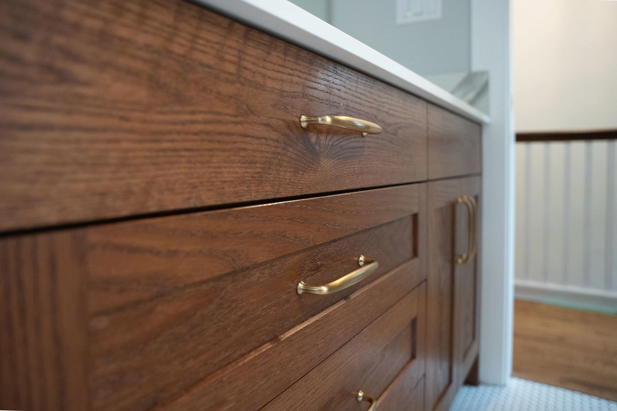 Solid wood cabinetry with bronze drawer pulls