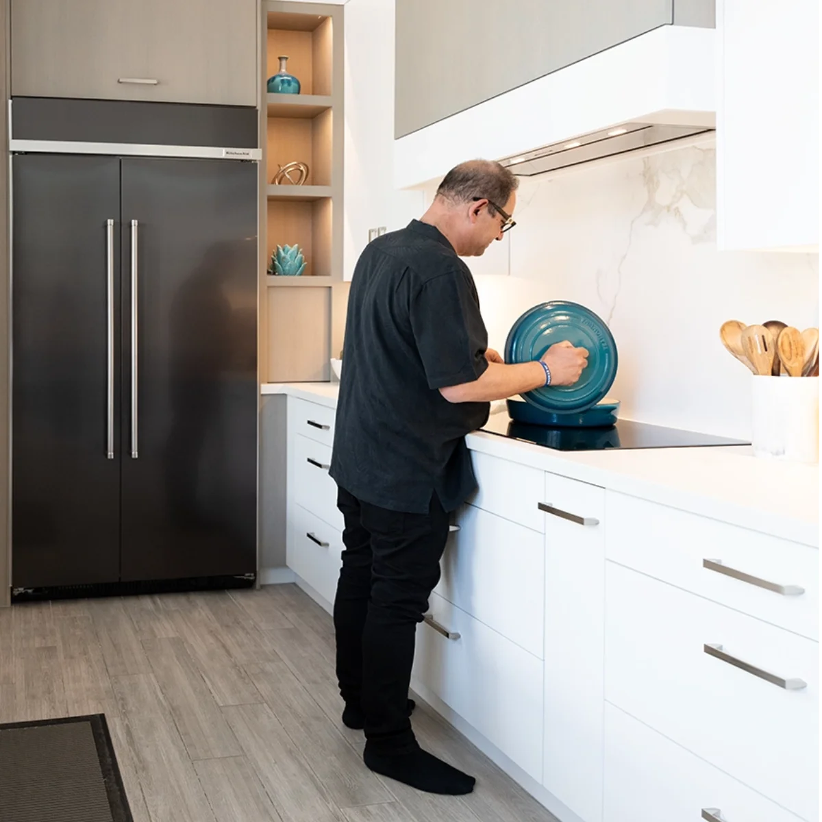 Homeowner cooking at stovetop 