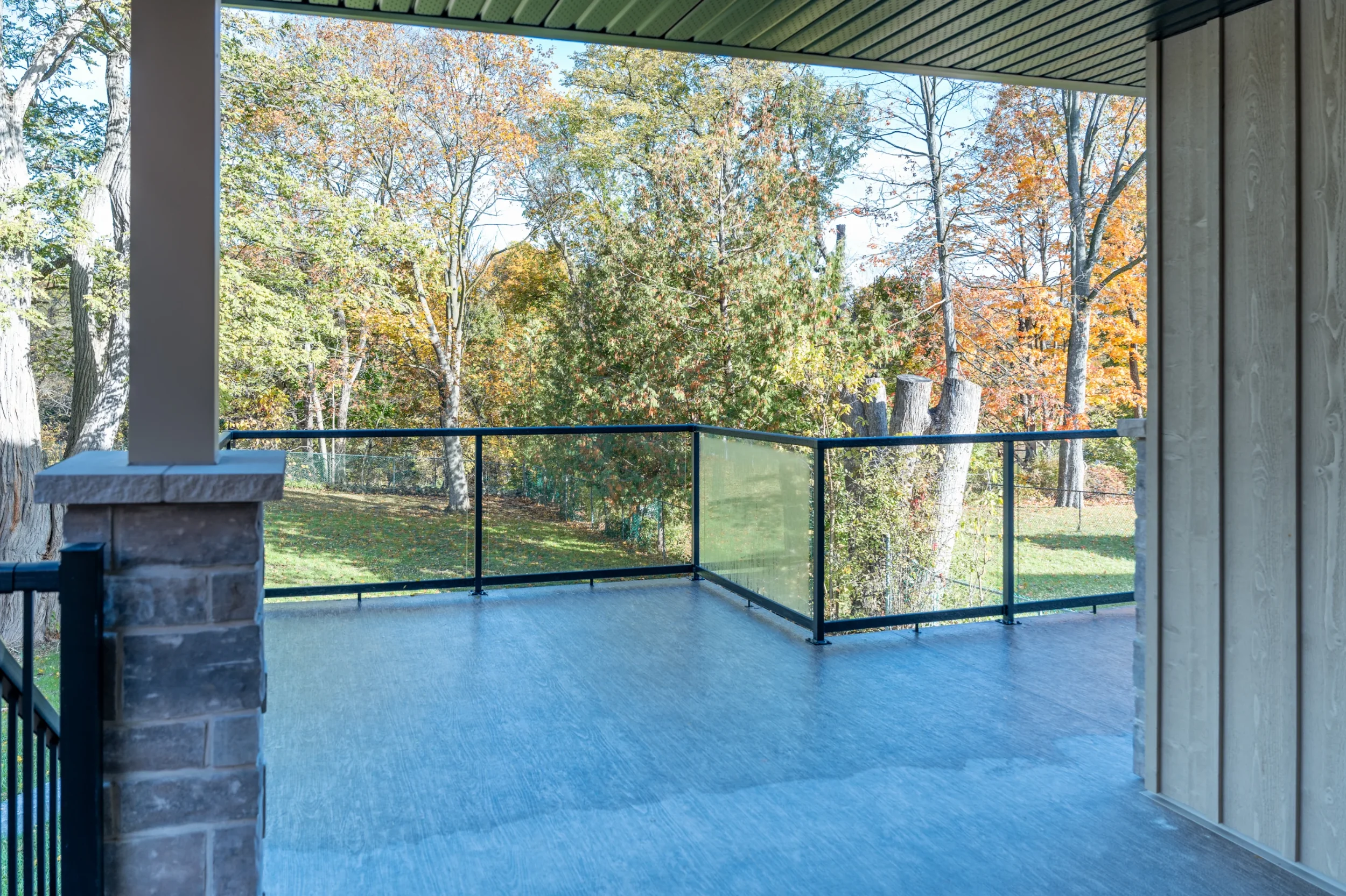 exterior of duplex with large space on a rear deck with safe railings and accessible sights