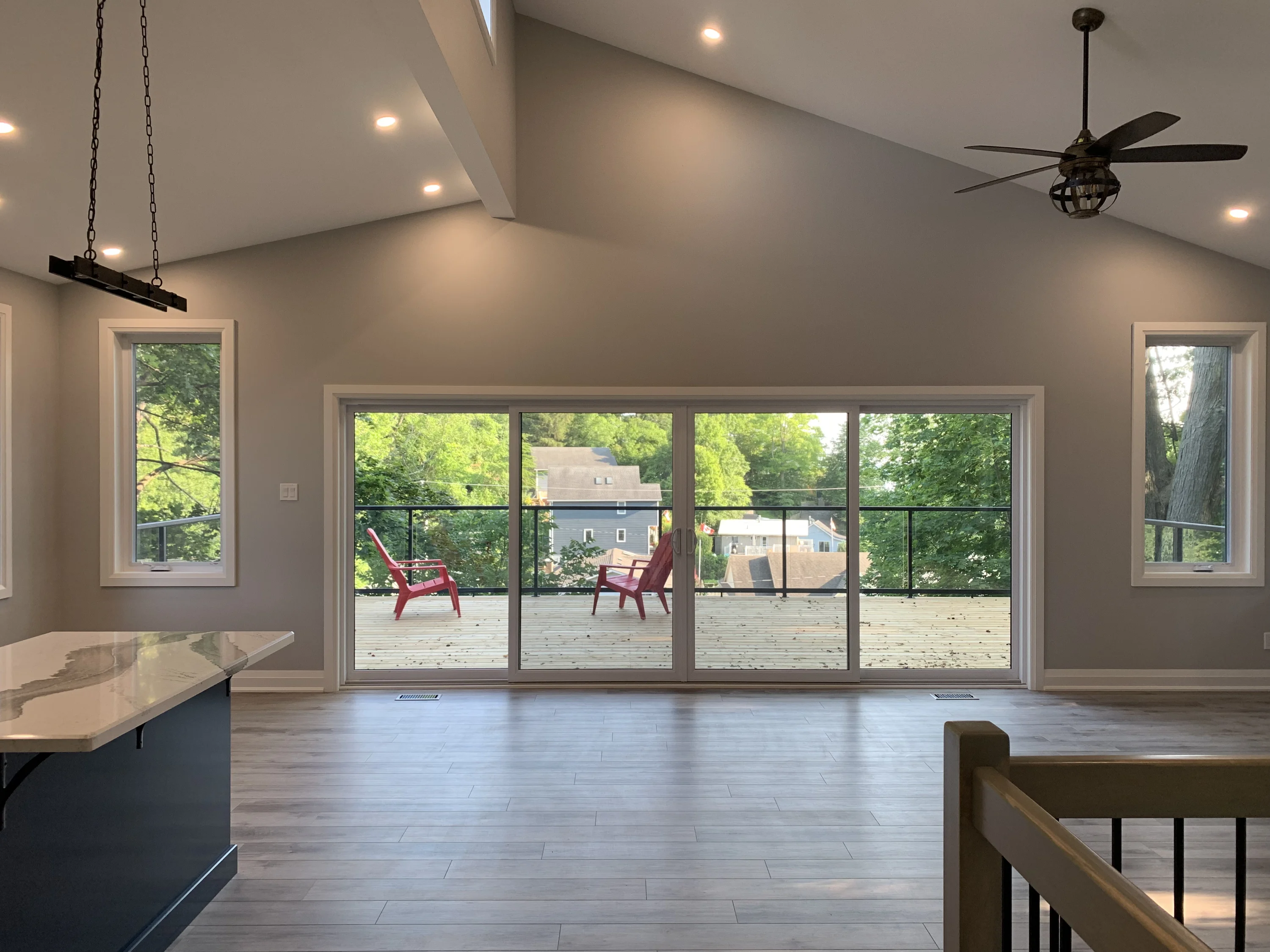 interior of cottage with large windows and floor plan