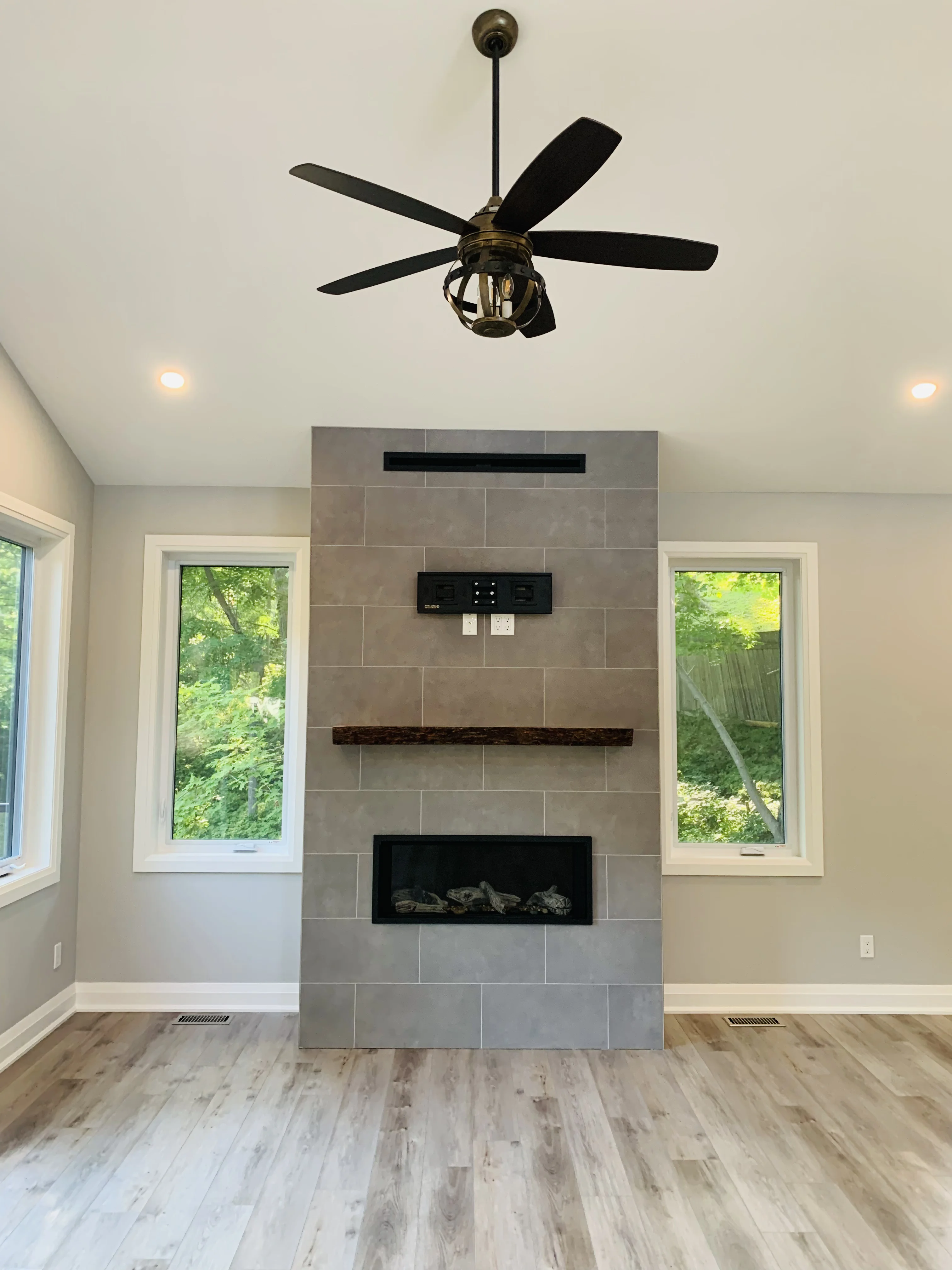 large fireplace dominates a living space