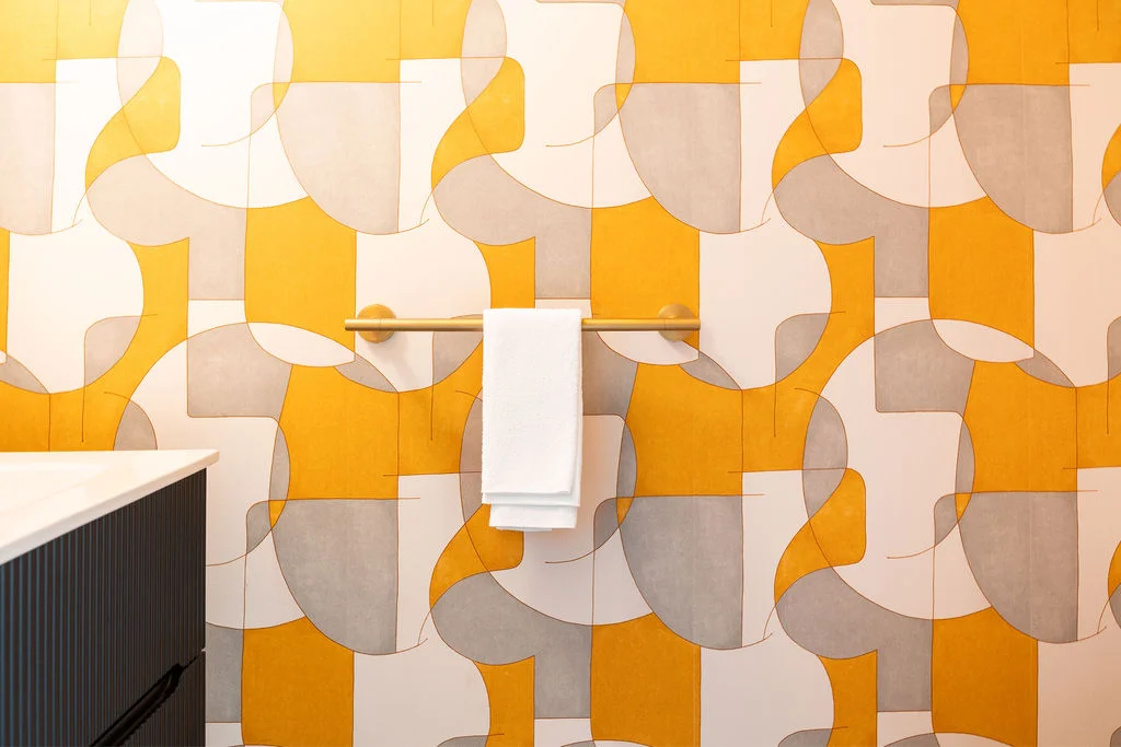 bathroom wall design in yellow and grey