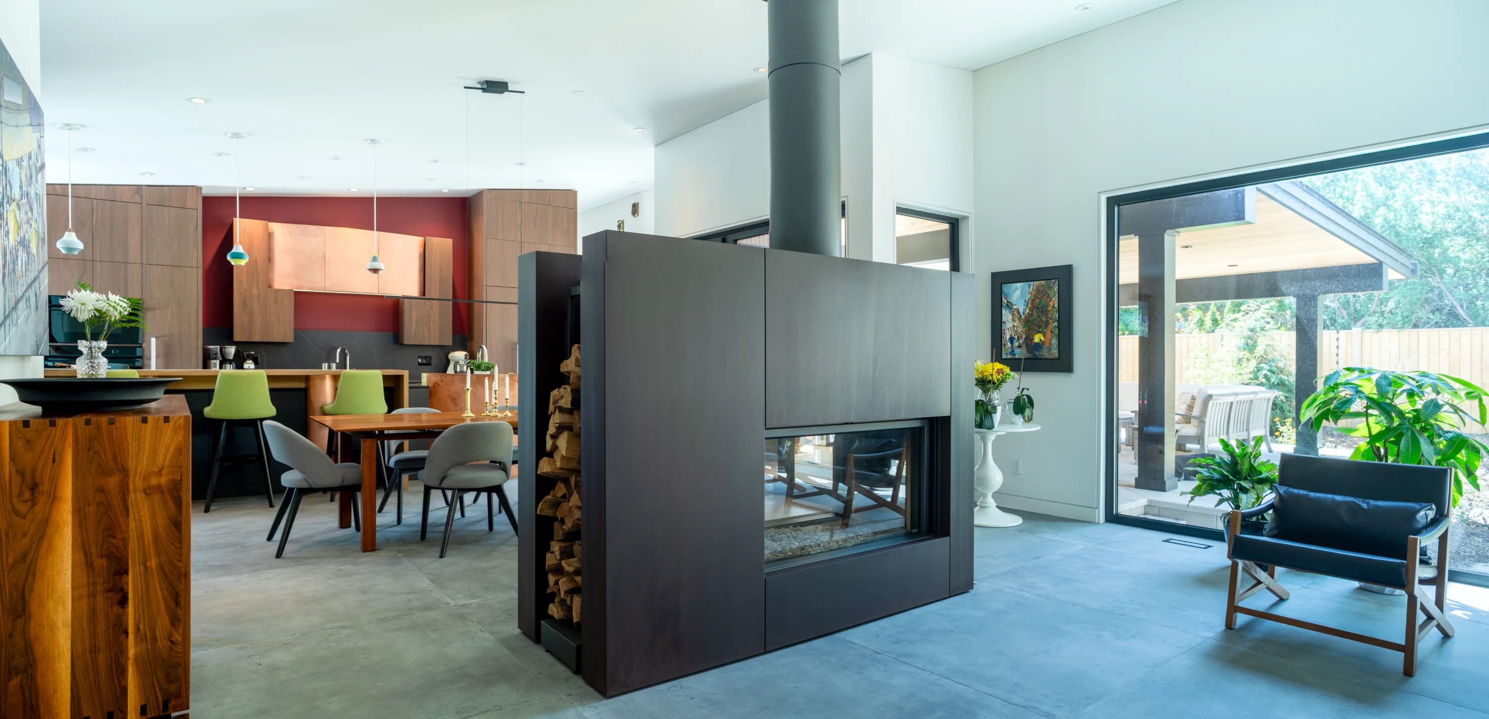 large living space area with fireplace, kitchen, chairs, living room