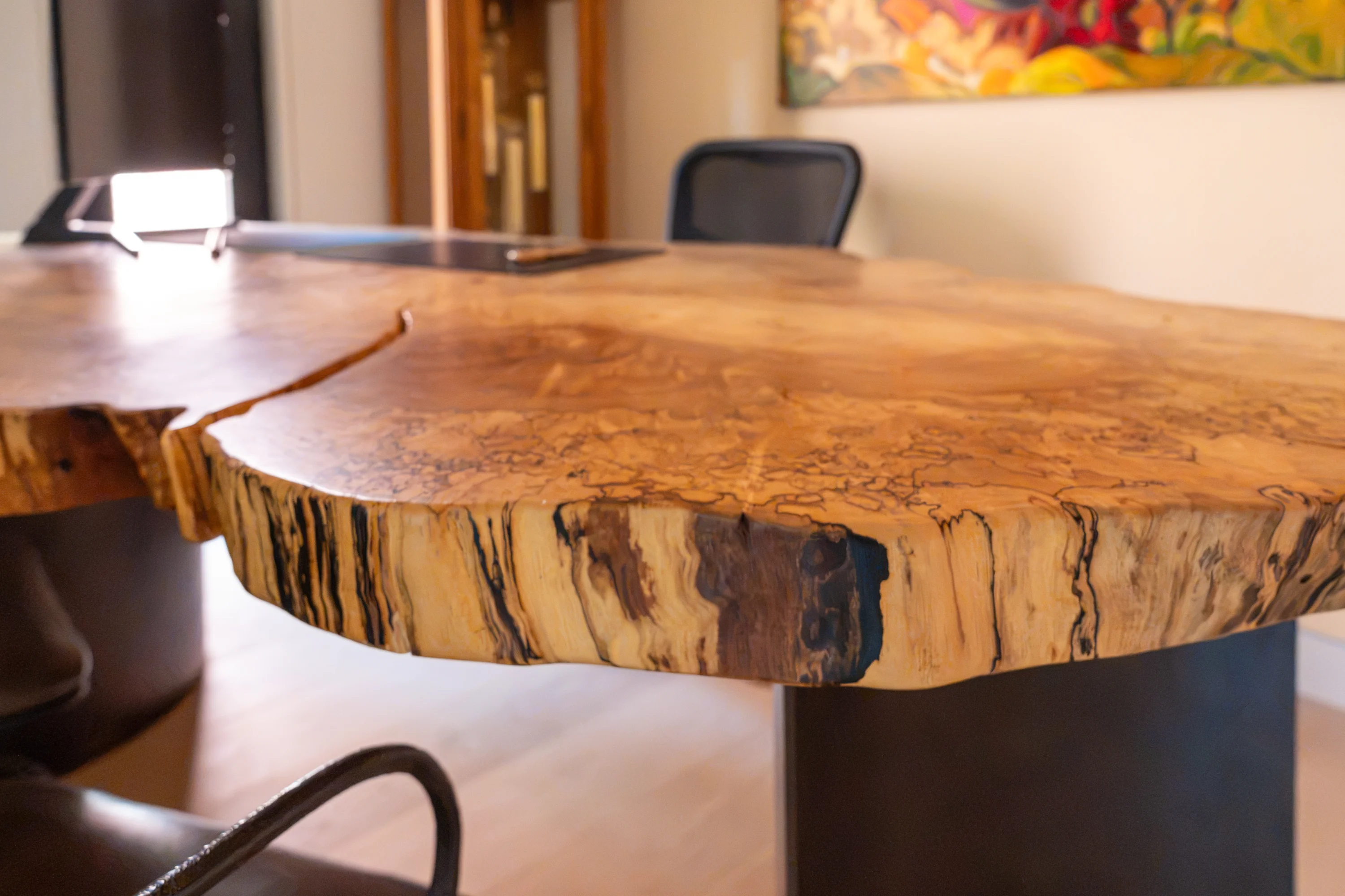 carved tabletop in wood in an office