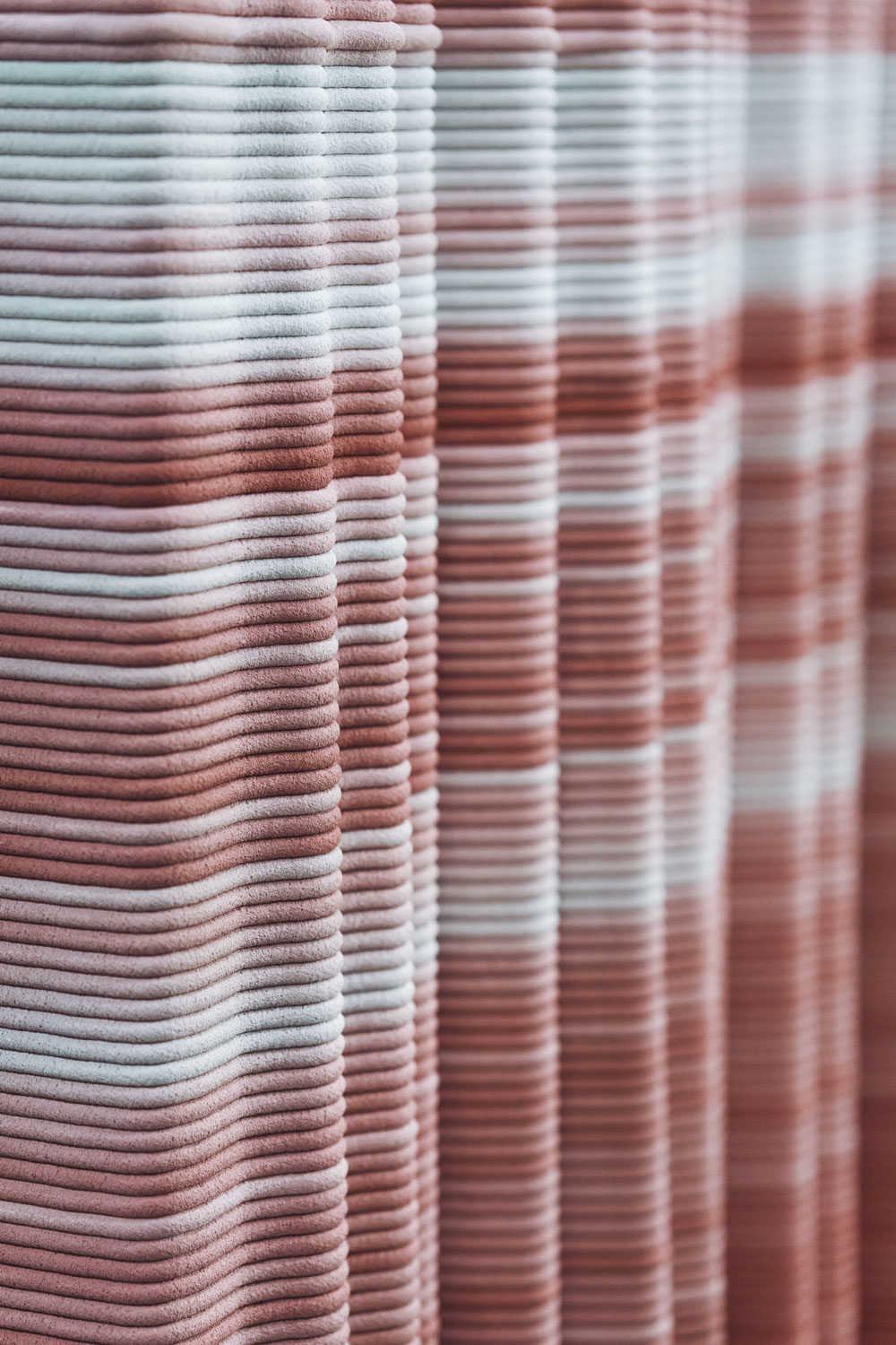 3D concrete printing with layered pink and blue textured material