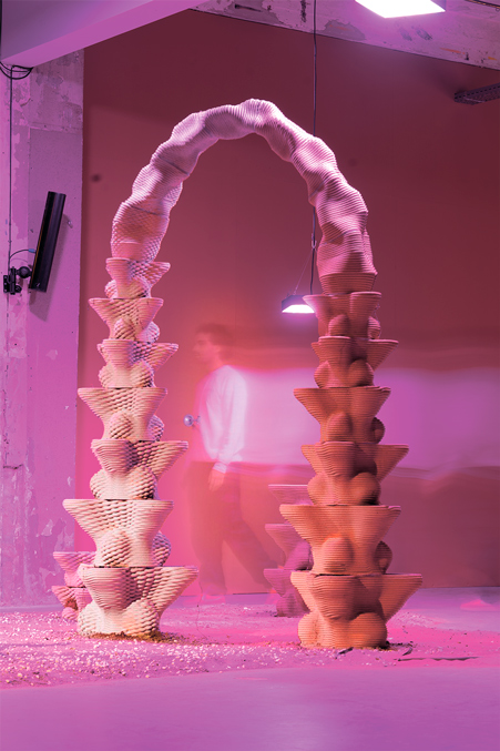 Curved concrete 3D printing arch exploring architectural projects in pink light
