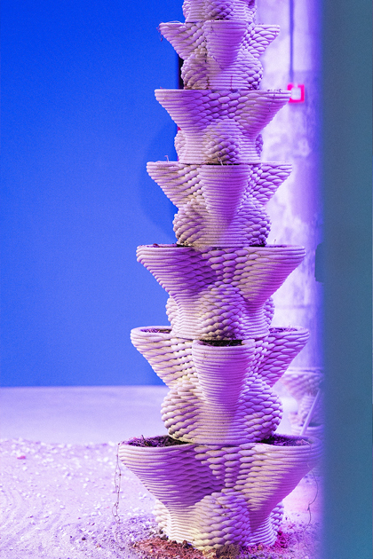 3D printed concrete architectural model with twisted geometric layers in purple