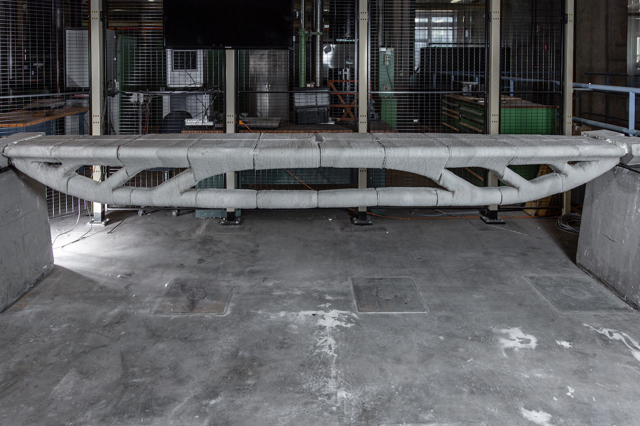 3D printed concrete bridge structure in industrial manufacturing facility