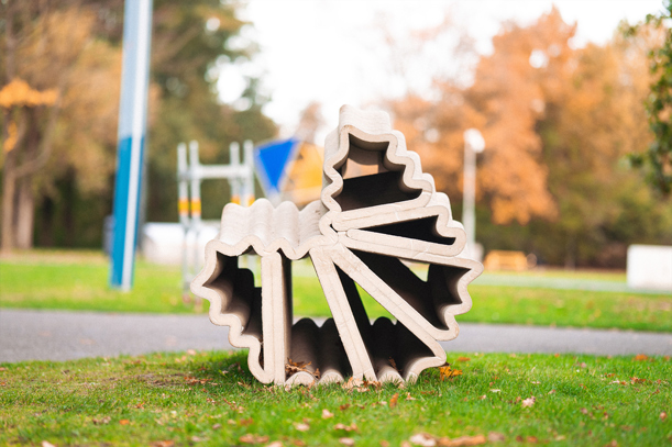3D concrete printing creates abstract spiral sculpture in autumn park setting