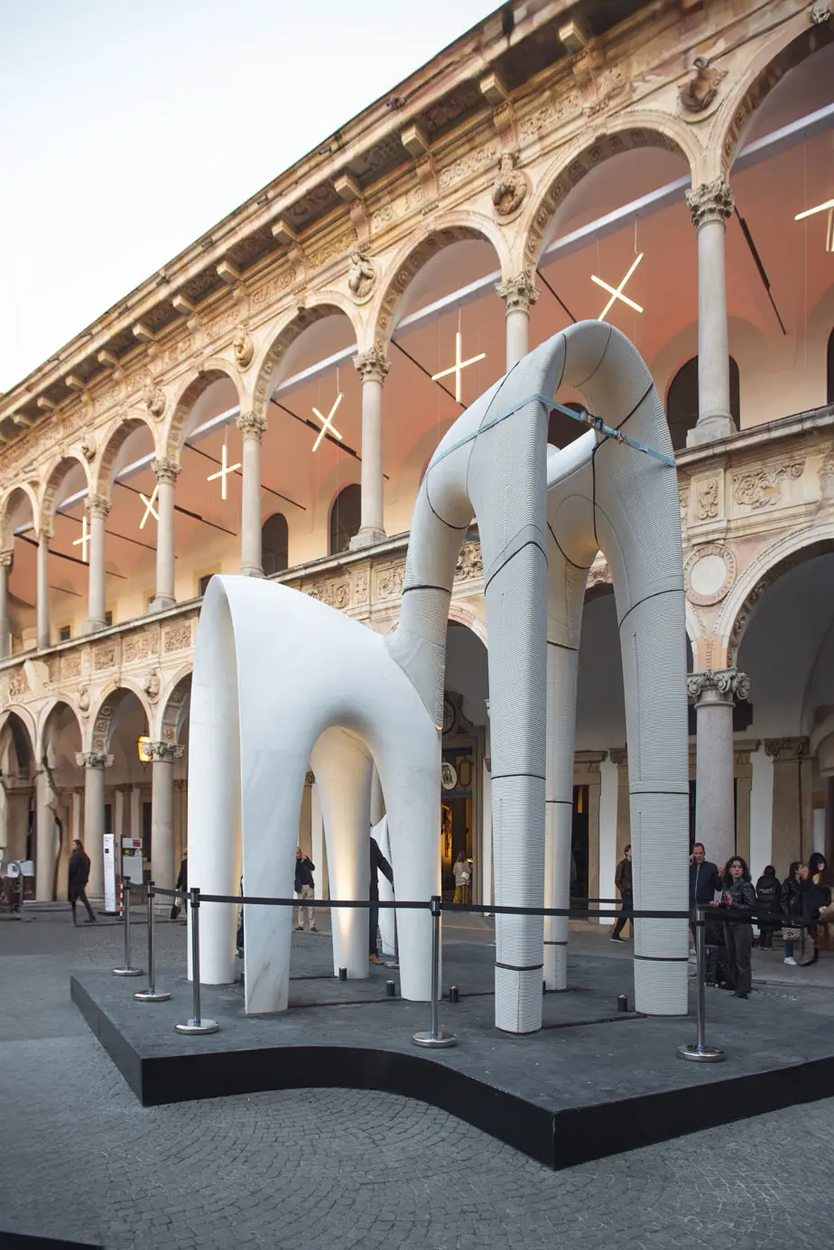 Concrete 3D printing projects displayed in historic arched architectural space