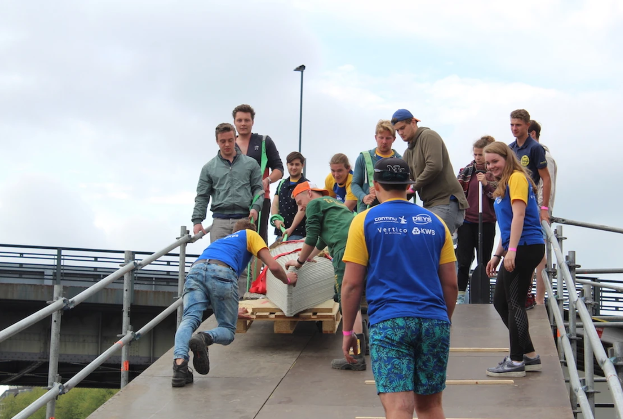 Students work on concrete printing projects using collaborative teamwork