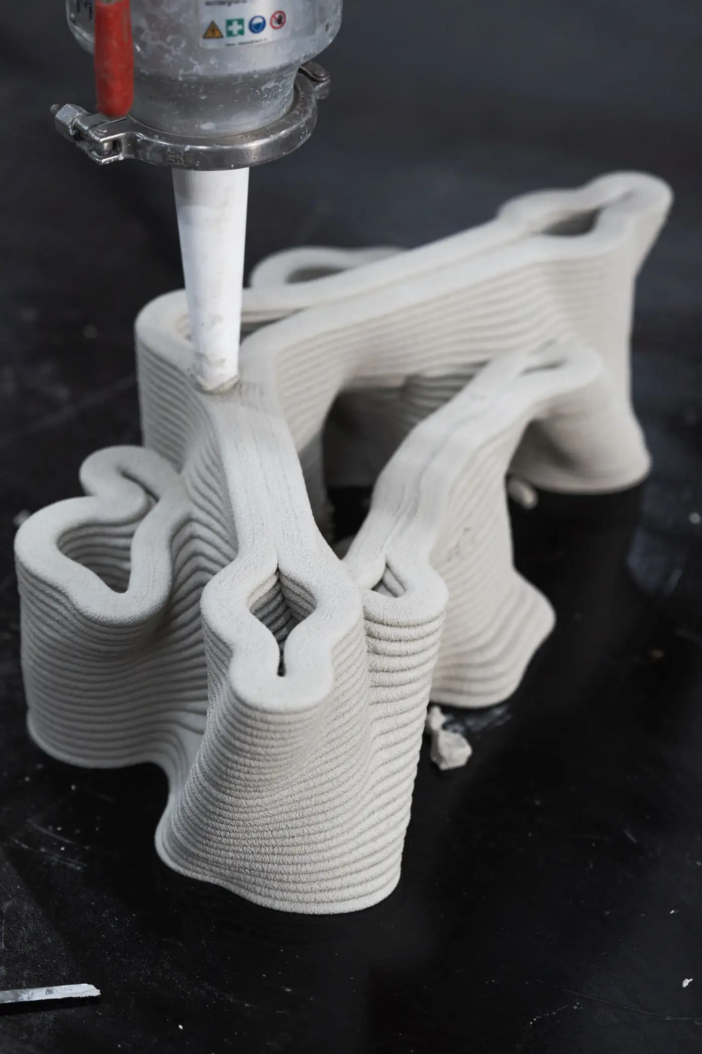 3D concrete printing project creating intricate, layered sculptural form