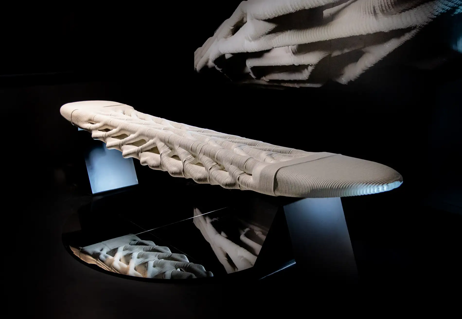 Concrete 3D printing project with organic, layered sculptural bench design