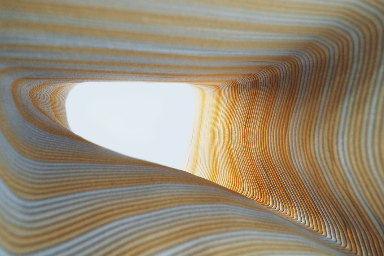 Abstract curved layers in warm golden and silver tones