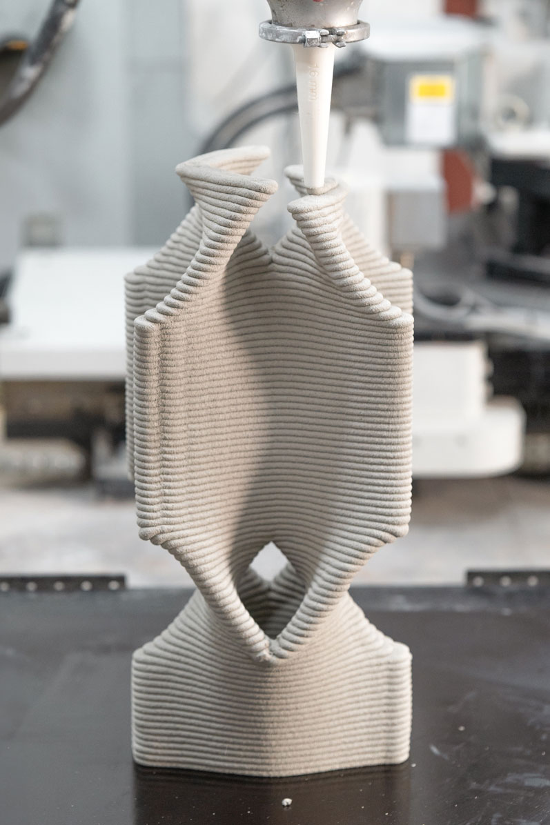 3D printed sculptural object with horizontal ribbed texture in light gray