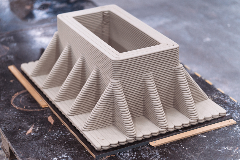 3D concrete printing project with layered geometric structure and rectangular form