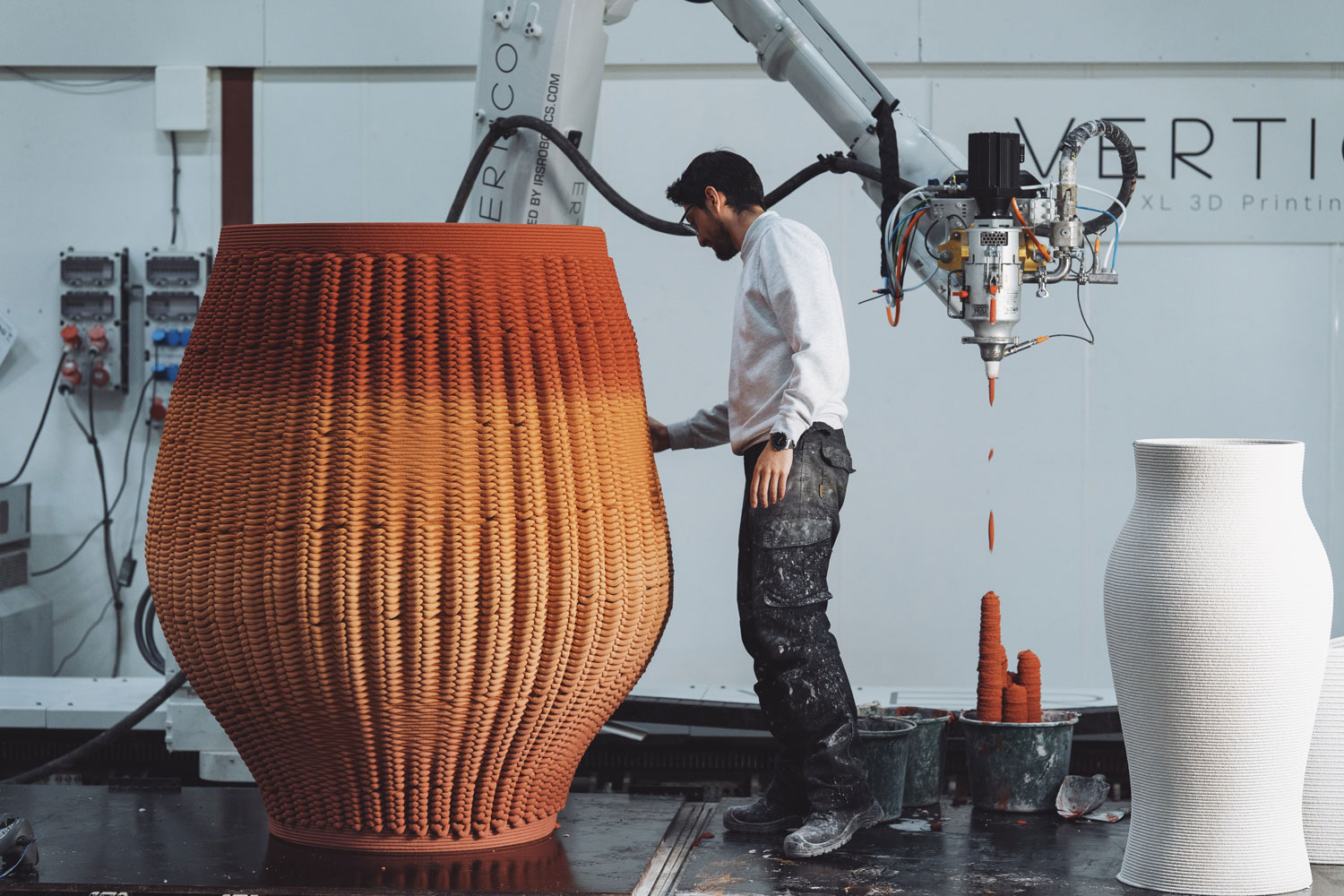 3D concrete printing project creating large sculptural vessels with robotic arm