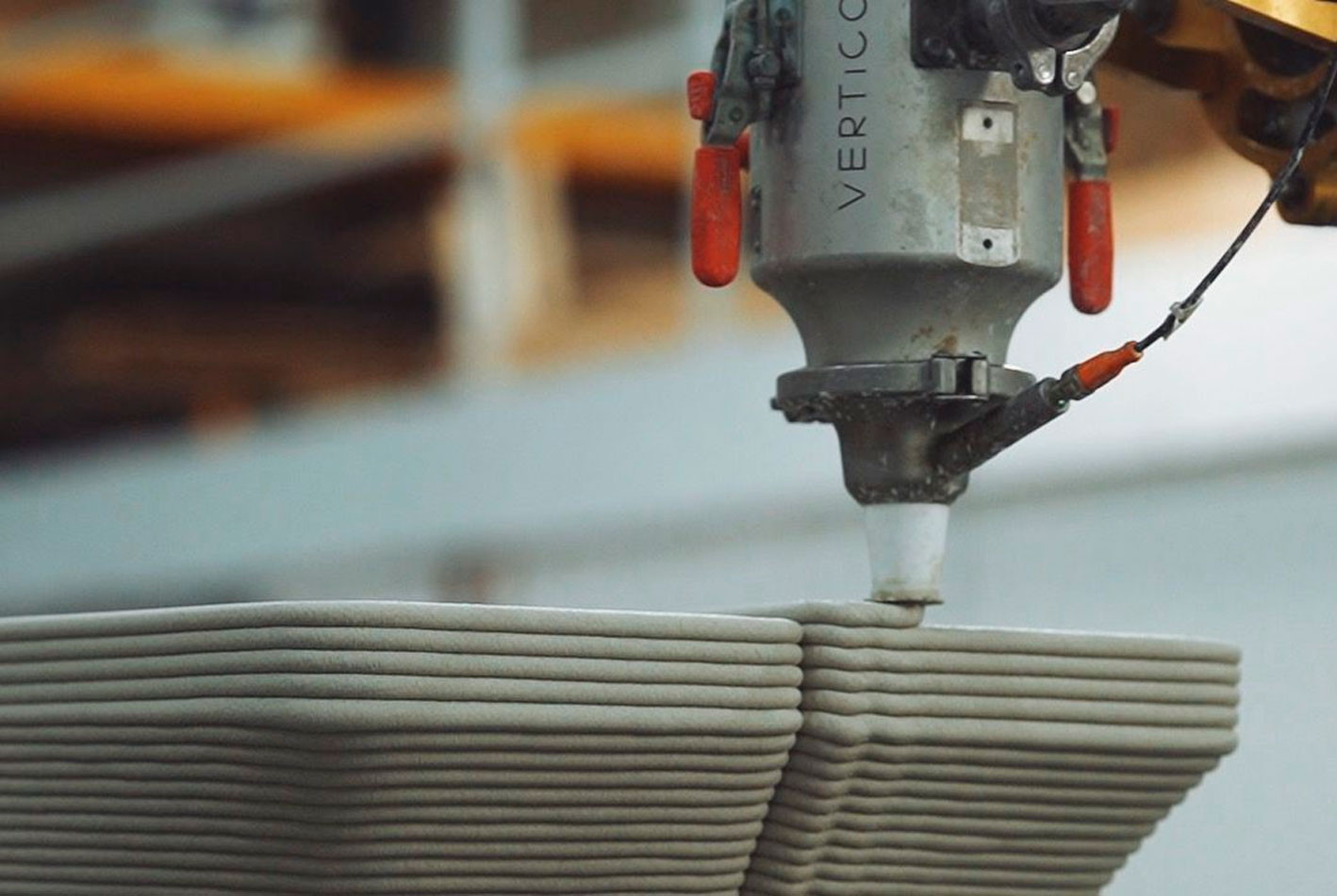 3D concrete printing projects with robotic machine laying precise layers