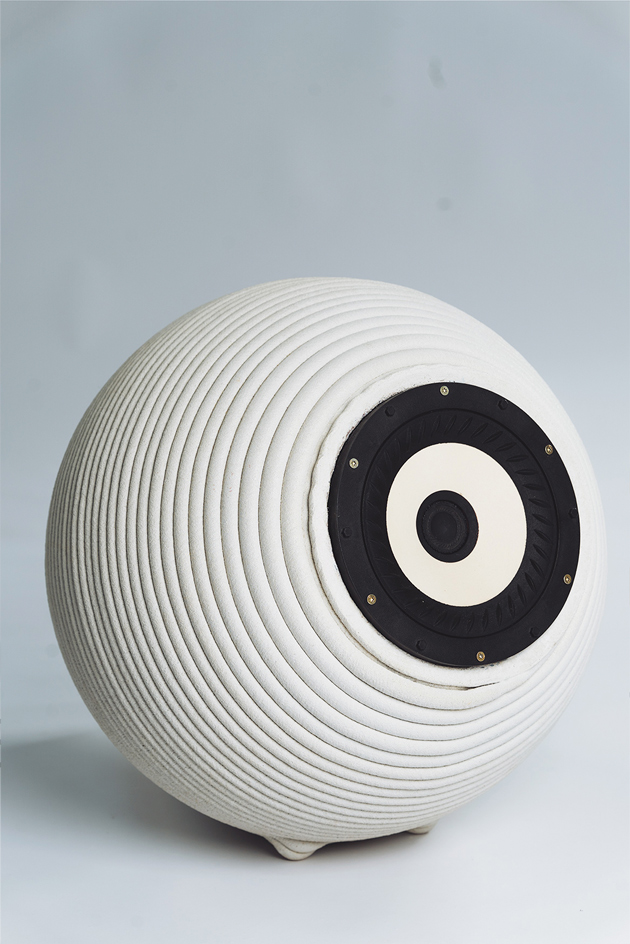 3D printed concrete spherical speaker with ribbed texture and circular design