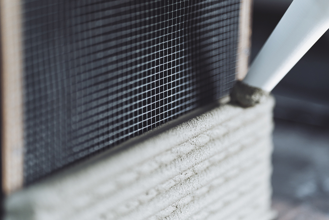 3D concrete printing project with reinforcing mesh and textured surface
