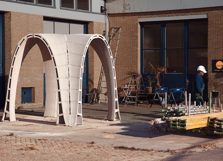 3D concrete printing project with curved architectural structures on construction site