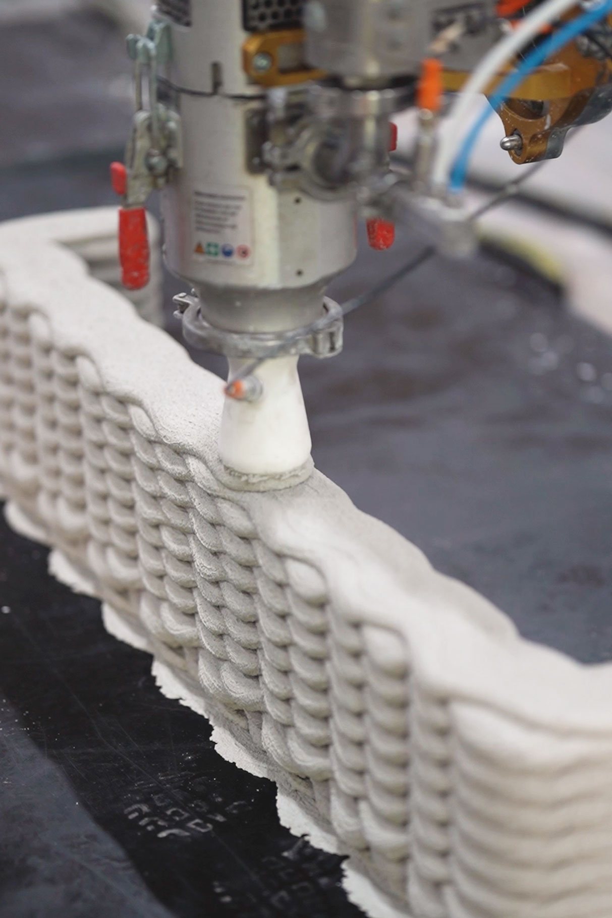 3D concrete printing creates intricate textured structure with robotic precision