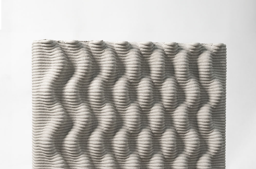 Textured grey surface with wavy horizontal rippled pattern