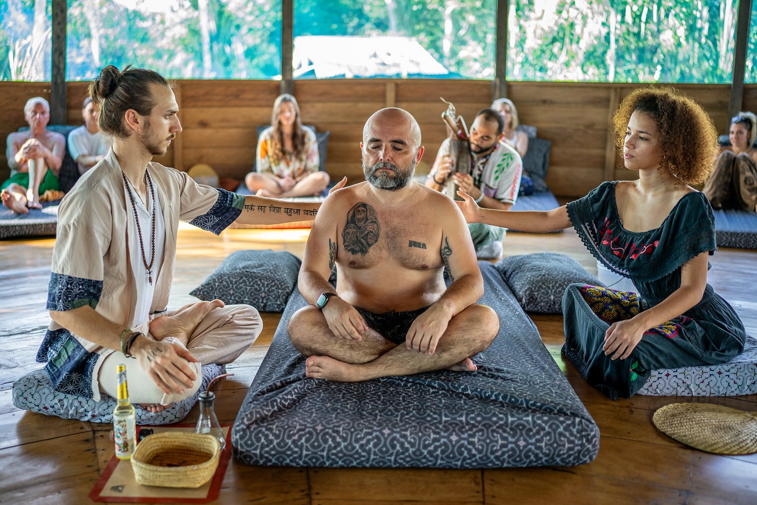 A man receiving a sapo ceremony at an ayahuasca retreat in Peru. 