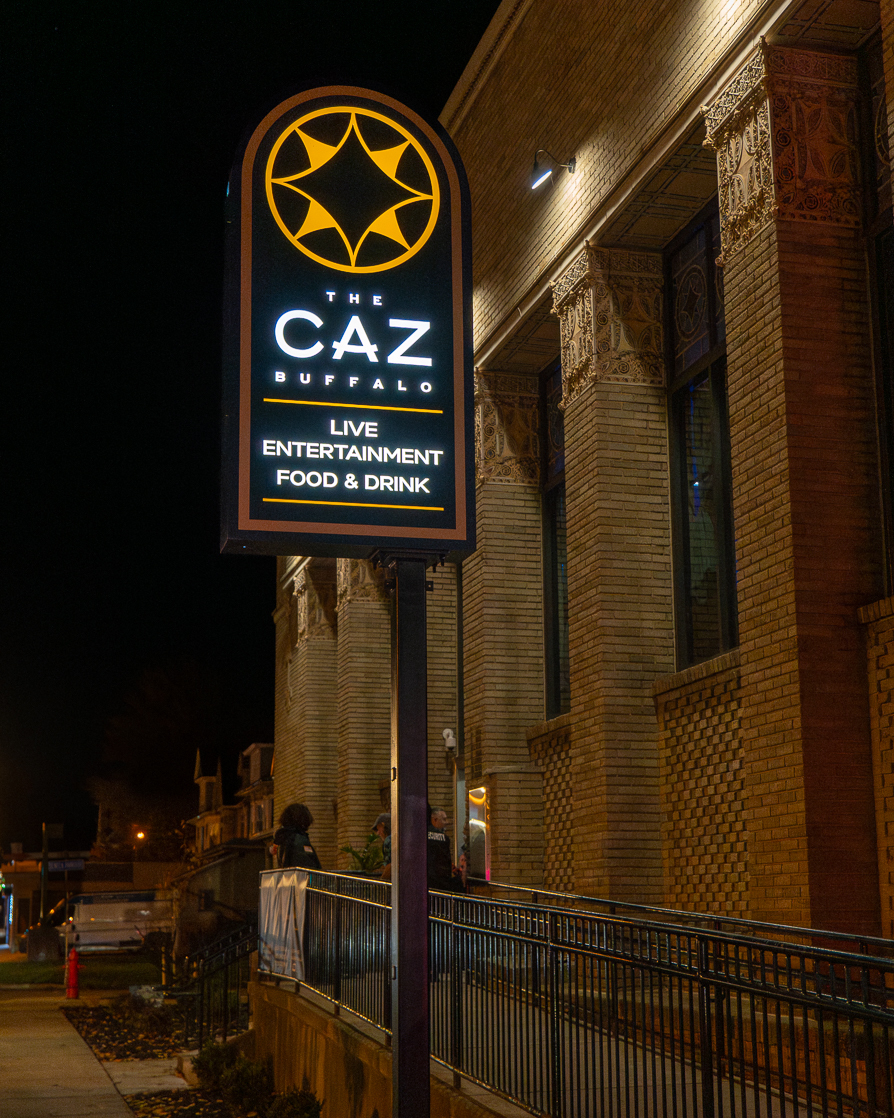 The Caz sign outside the venue at night
