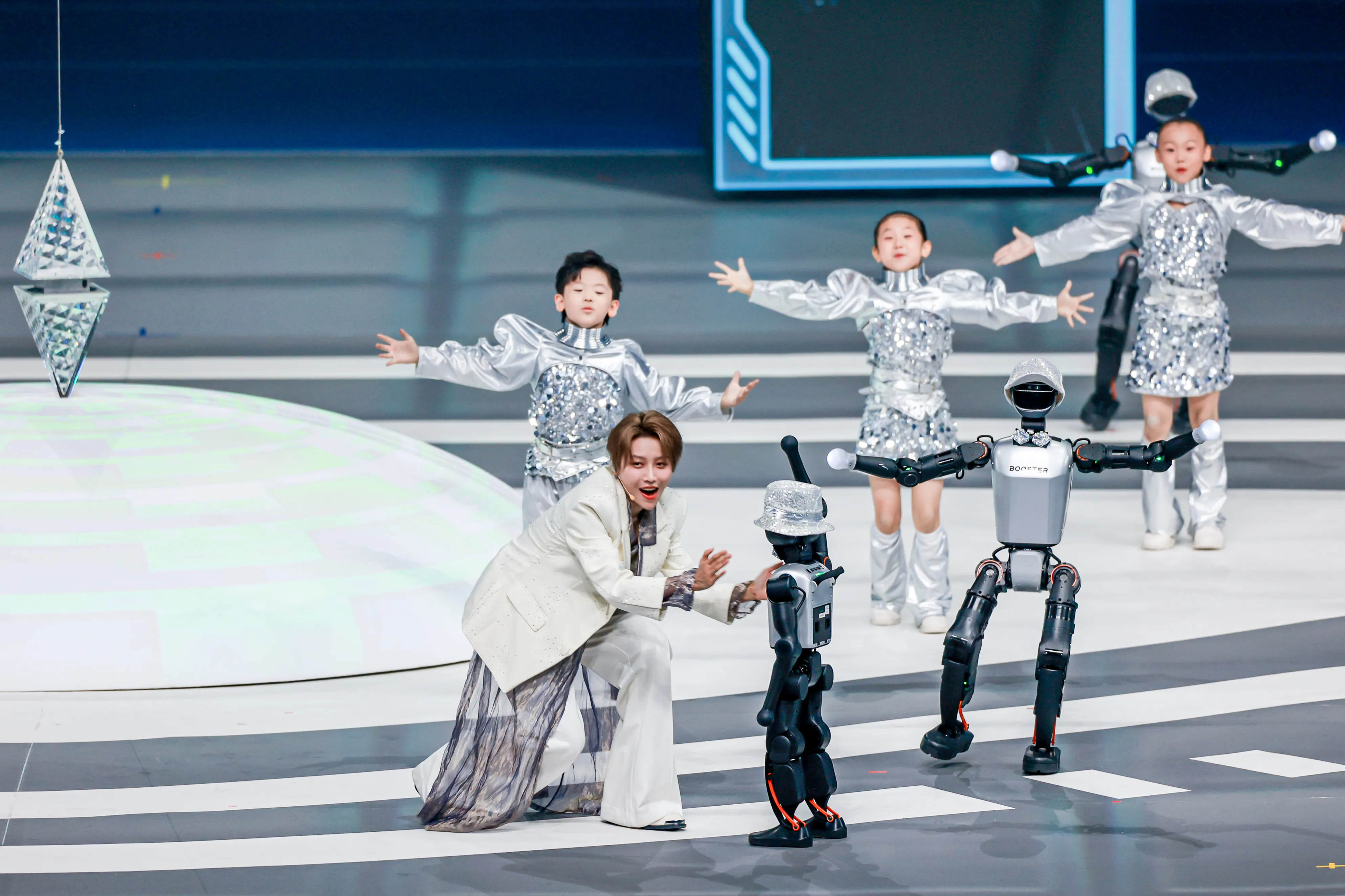 Booster K1 humanoid robots performing with dancers demonstrating entertainment and human-robot interaction applications