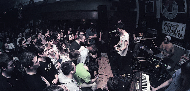 A band playing to a crowd packed close to the stage at The Camel