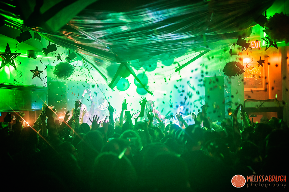 Confetti falling over a cheering crowd at a New Year's Eve show at The Camel