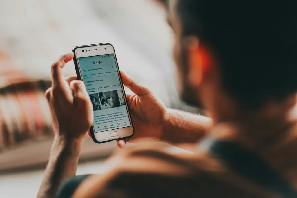 Person reading news on a smartphone