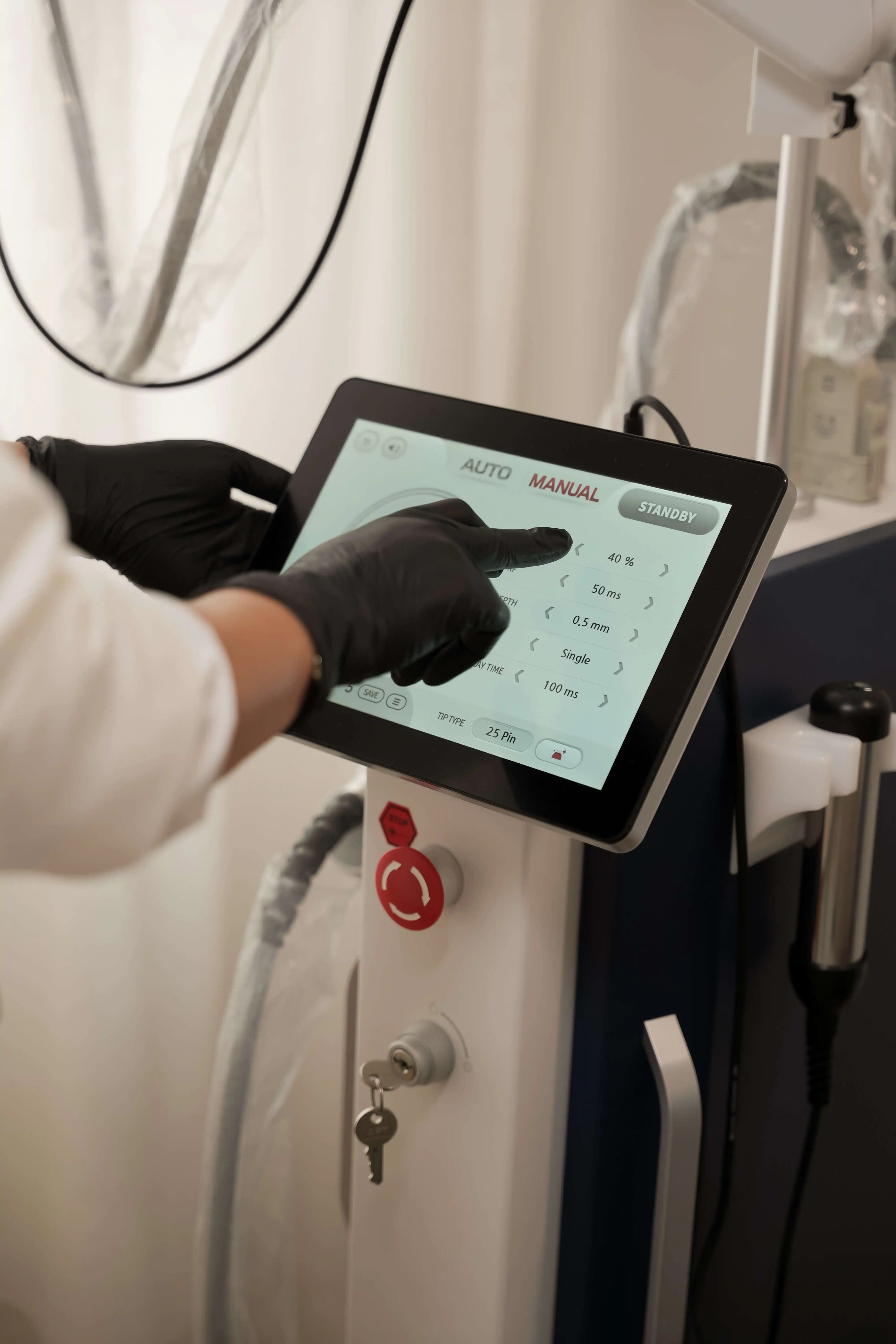 someone is using a tablet to check the temperature of a machine