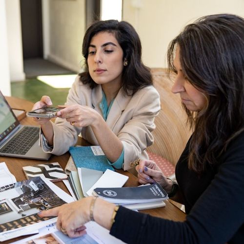 Creative professionals discussing design choices during a project planning session.