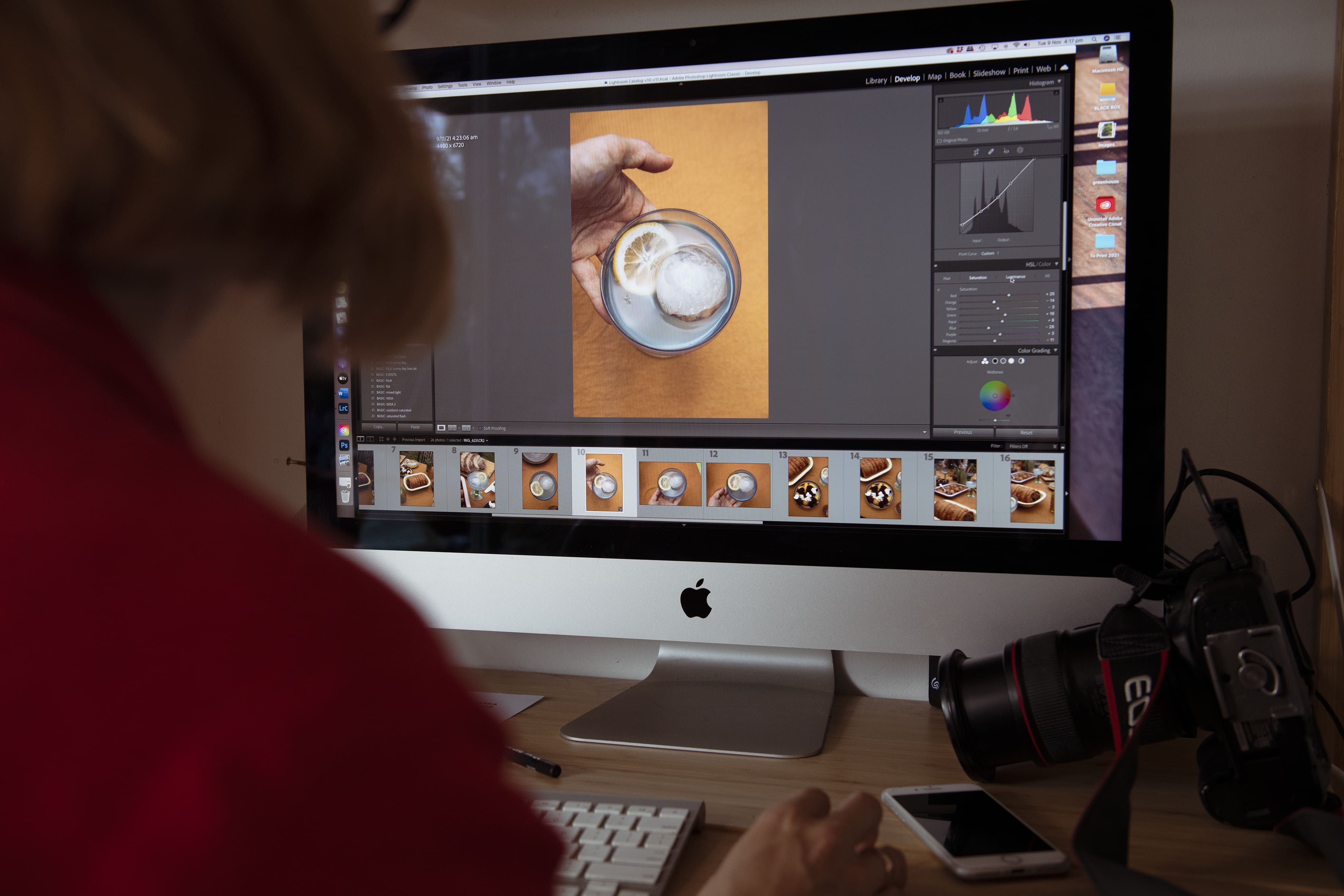 A person looks at an image on their computer while working on a campaign.