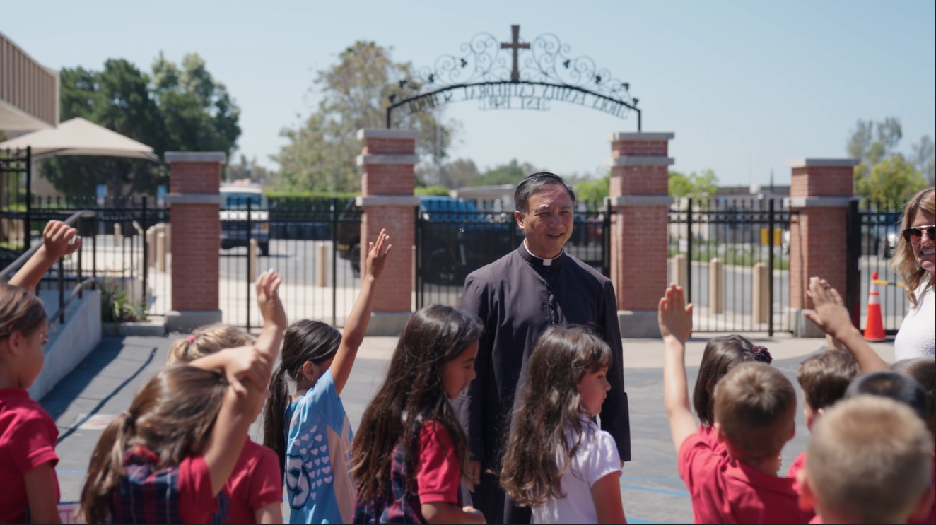 Fr. Sy with students