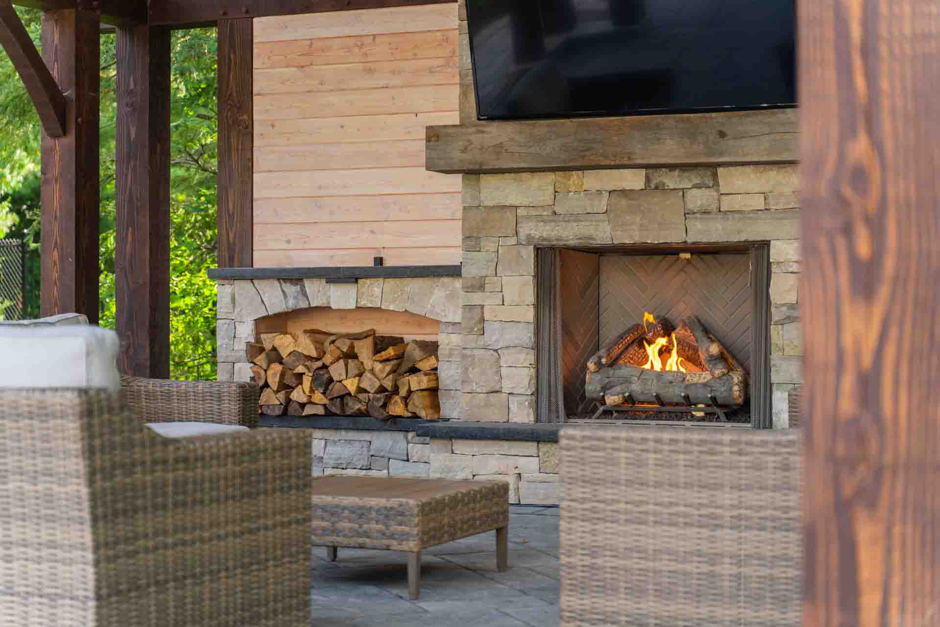 Backyard wood pergola with fireplace