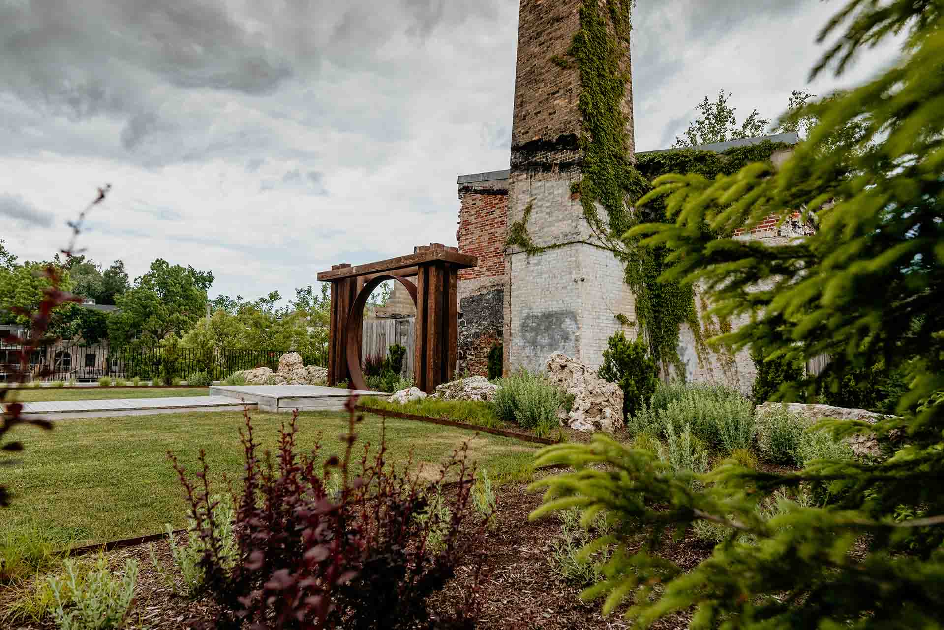 Elora Mill outdoor wedding chapel with built-in walkway, platform, and lush greenery.