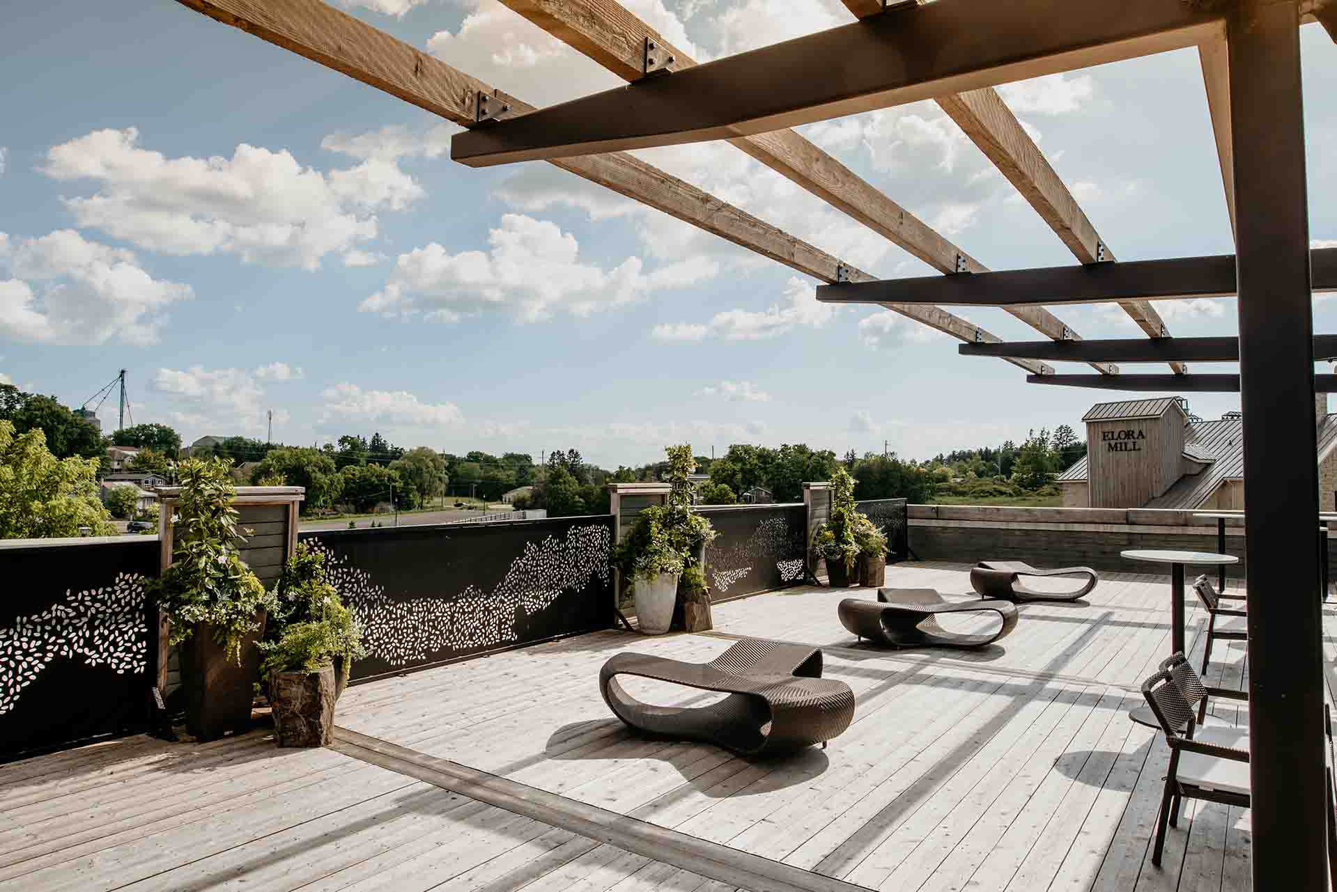 Elora Mill pool patio deck with large shade structure and custom luxury patio area.