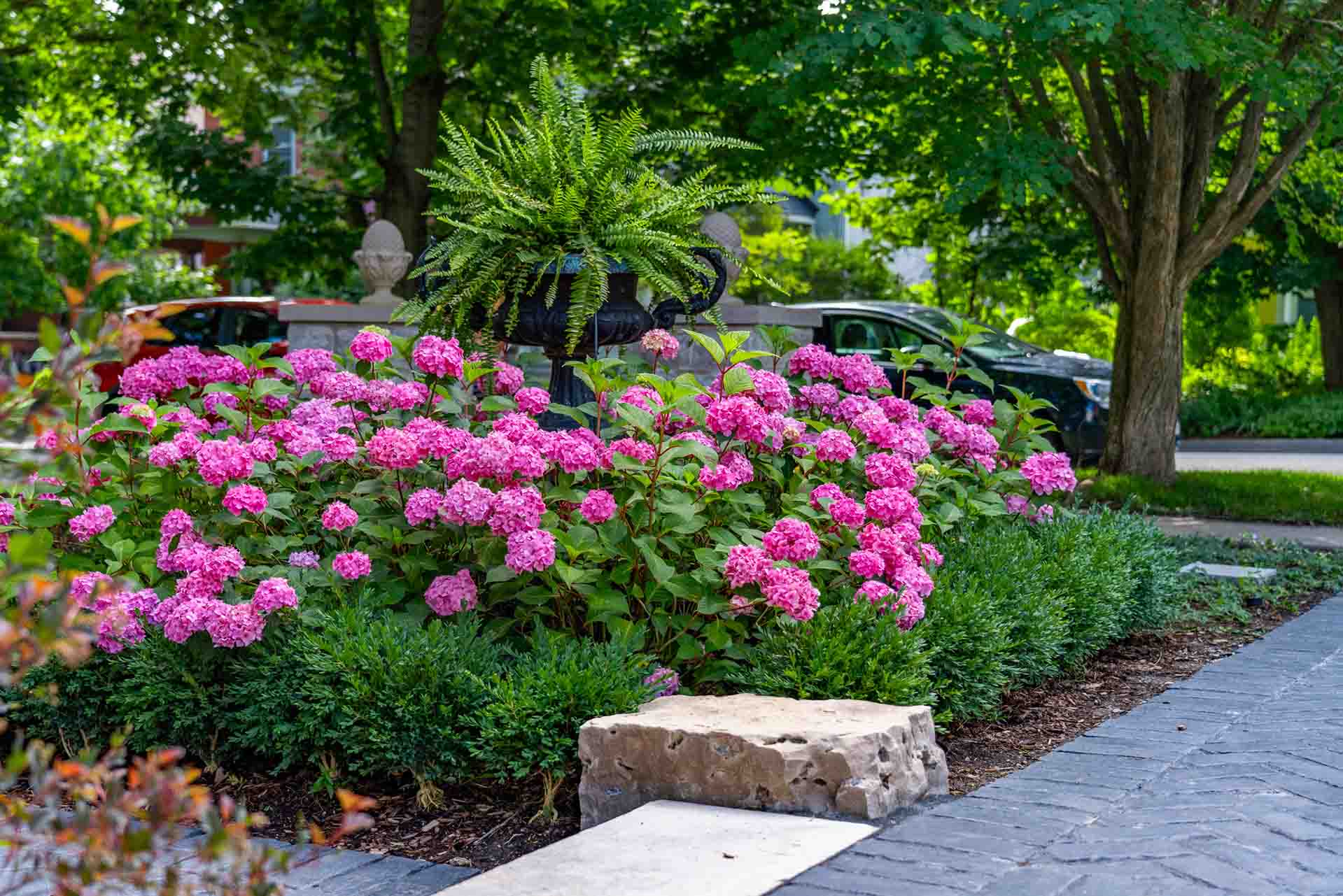 English country charm landscape design and construction rooted in tradition, designed to reflect the enduring beauty of historic English gardens and estates.