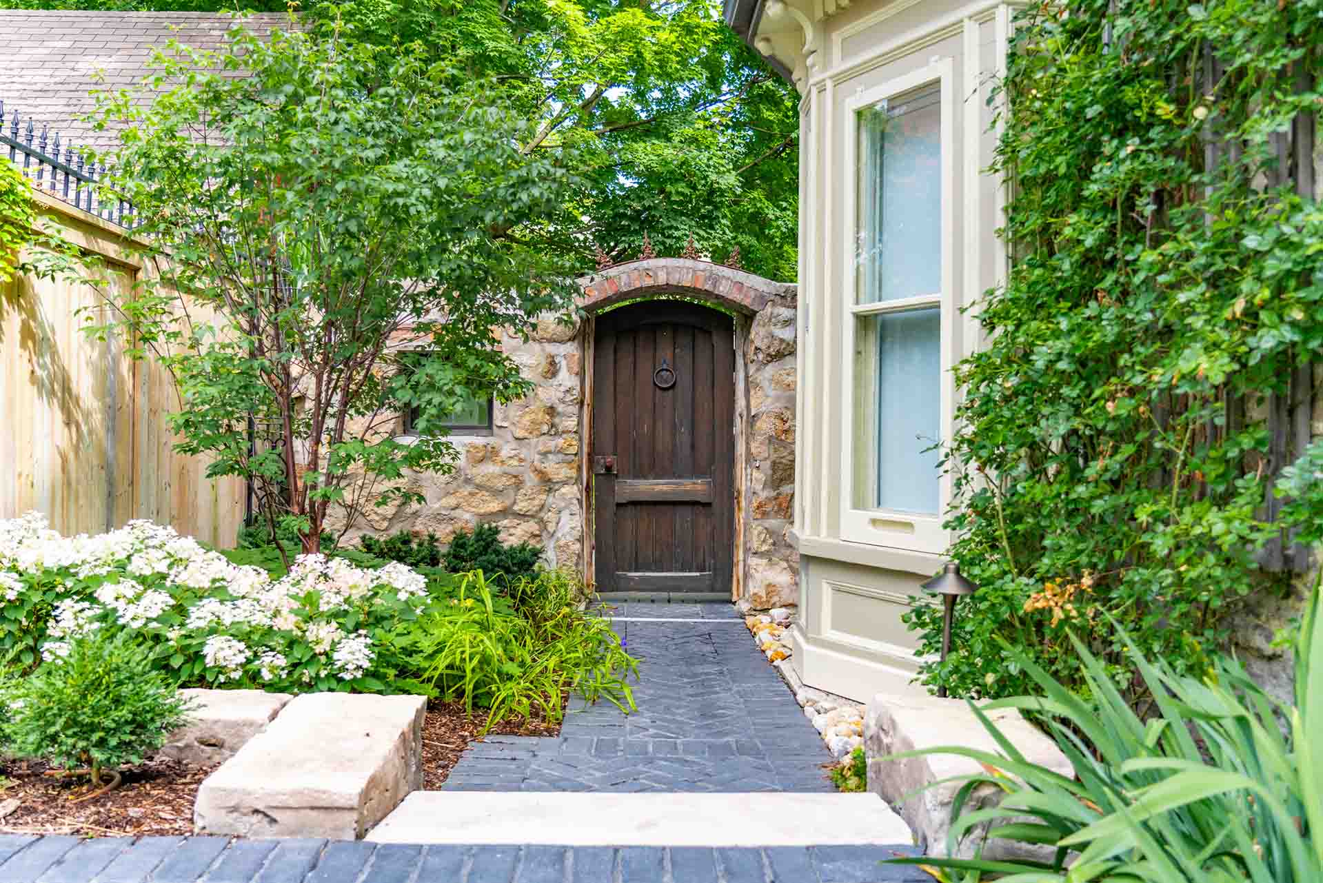 English country charm garden front entrance, drive, and backyard entrance.