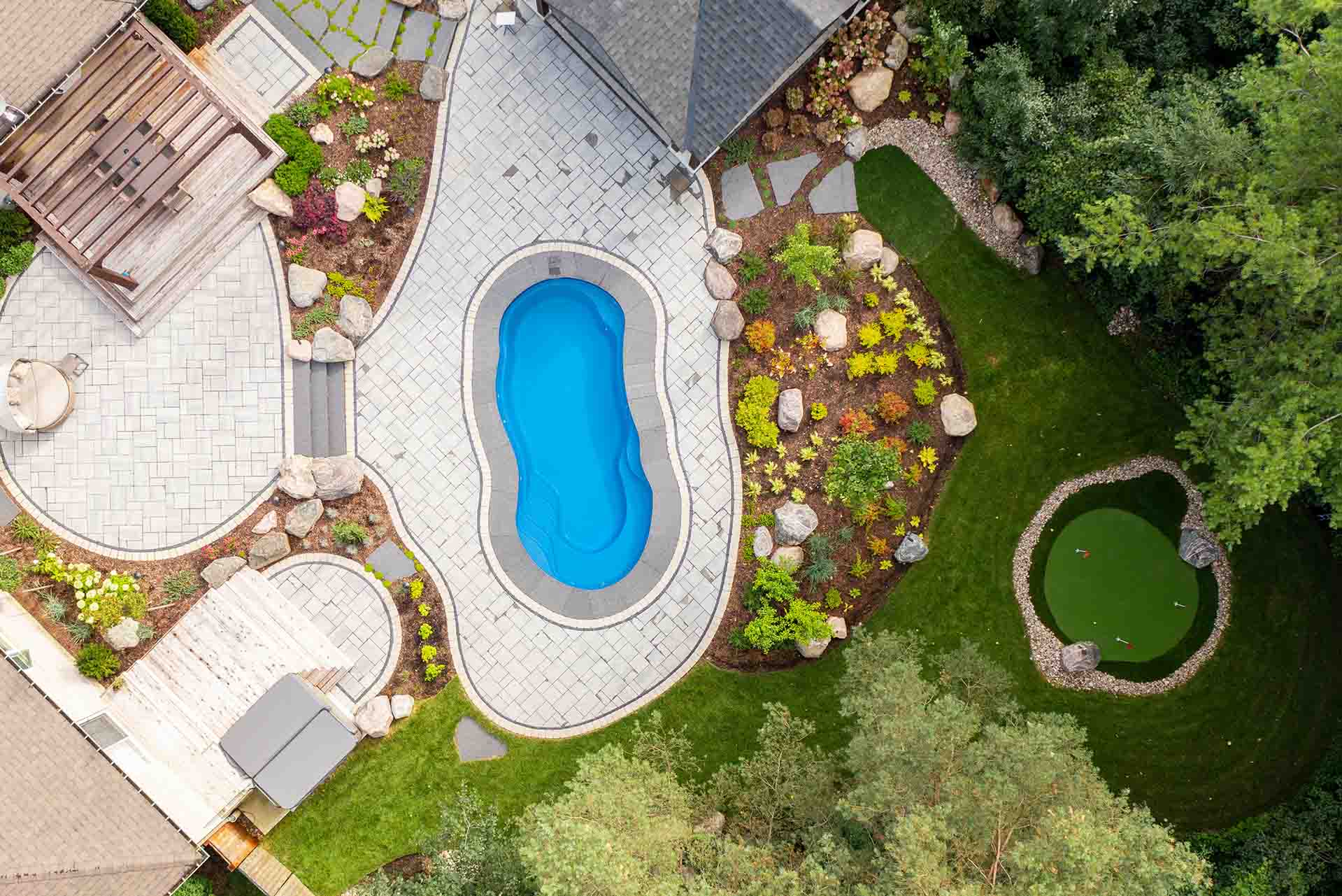 Luxury in-ground pool designed as part of a complete outdoor living space.