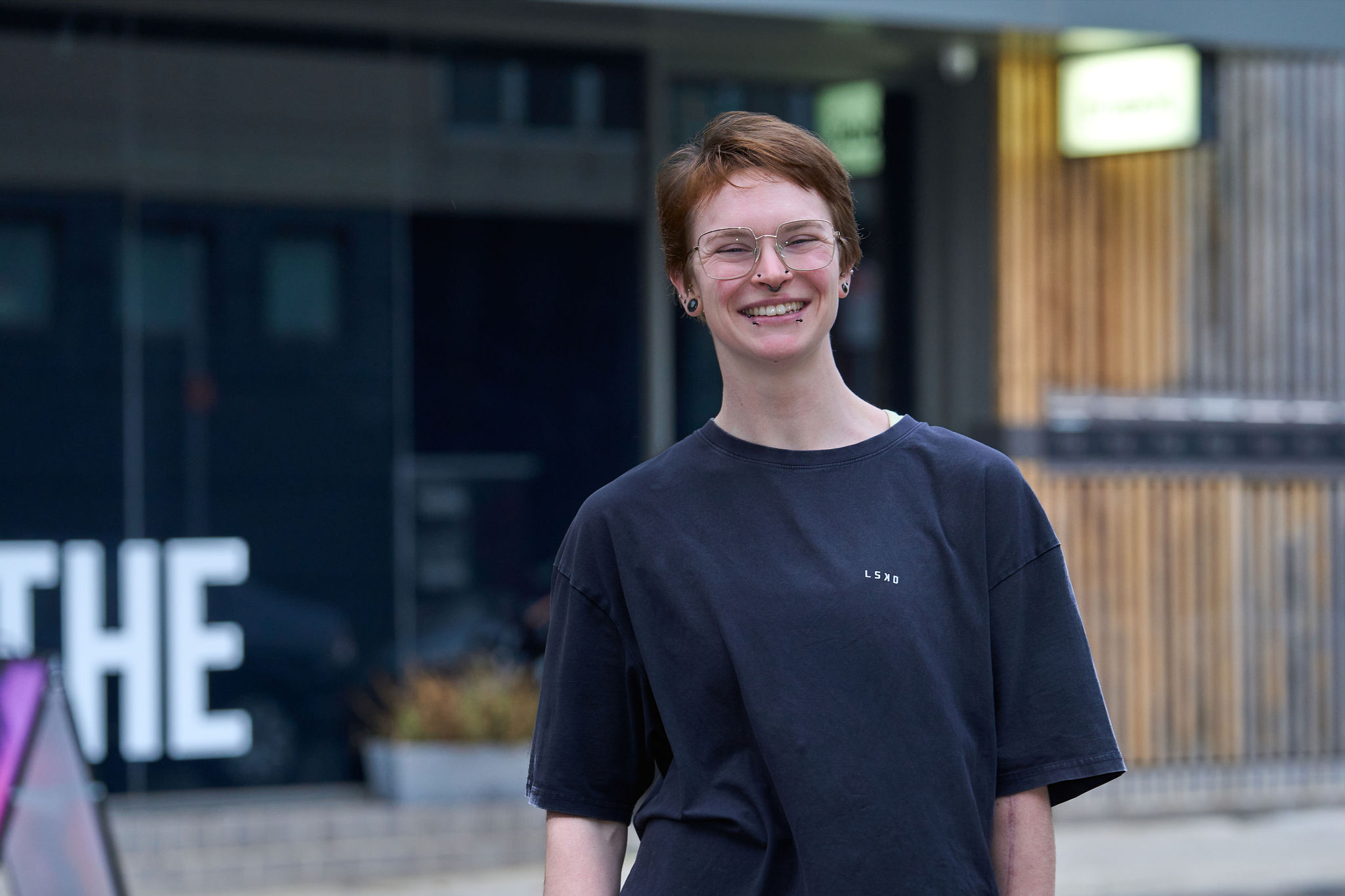 Estelle, a breathwork facilitator at No Name Studios smiling at the camera.